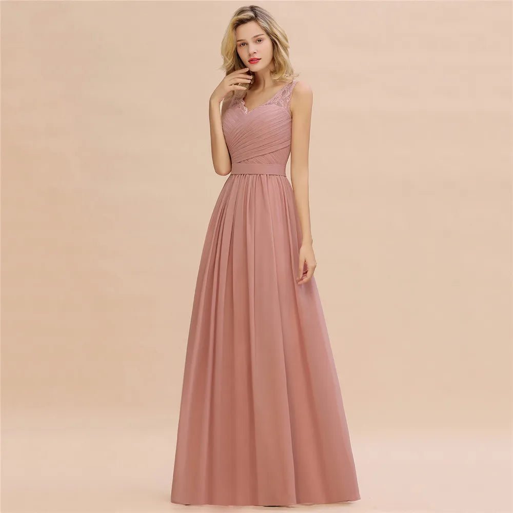 a woman wearing a long pink bridesmaid dress