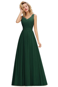 a woman in a long green dress