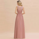 a woman wearing a long pink bridesmaid dress