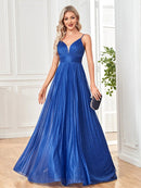 Elegant A-line spaghetti strap long flowing prom gown in deep blue.