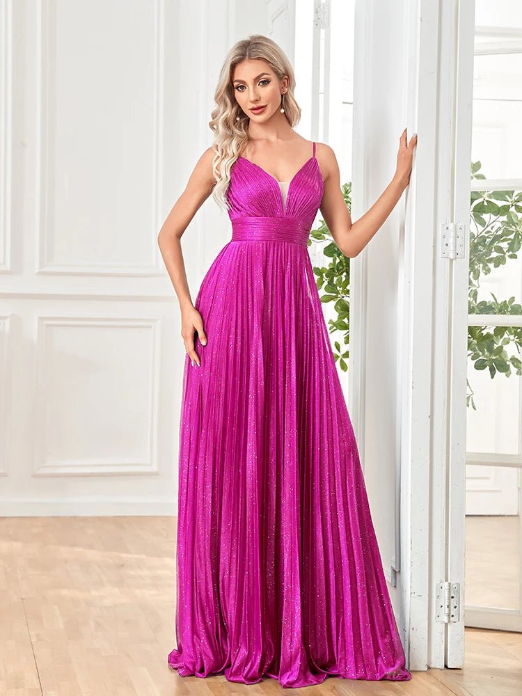 Elegant A-line prom gown with spaghetti straps, flowing drapes in teal.