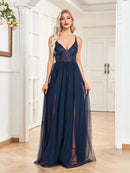 Applique sleeveless A-line evening dress in navy with intricate floral details.