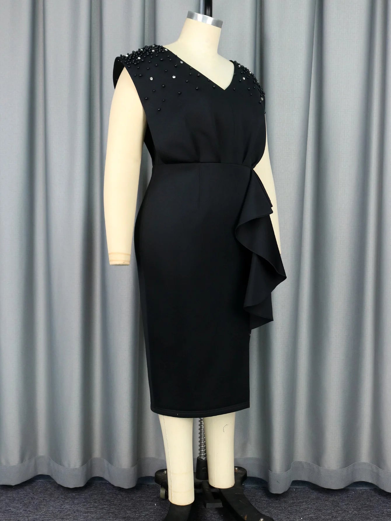 a mannequin with a black dress on it