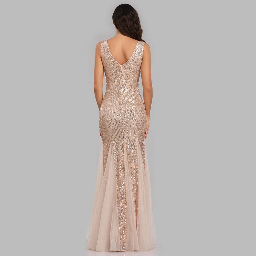 the back of a woman wearing a champagne colored evening gown