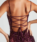 the back of a woman wearing a purple dress