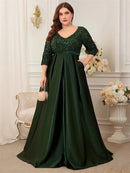 Elegant plus-size 3/4 sleeve sequin evening dress in navy blue.