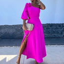 a woman in a pink dress with a high slit