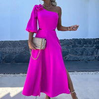 a woman in a bright pink dress