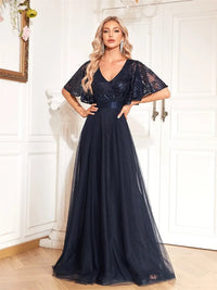 Elegant chiffon evening dress in navy blue, featuring flowing sleeves and a size medium.