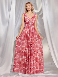 Elegant pleated chiffon dress in soft blush, ideal for wedding guests.