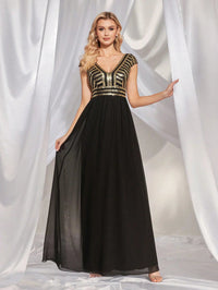 Elegant navy sequin cap sleeve chiffon evening gown, size 8.