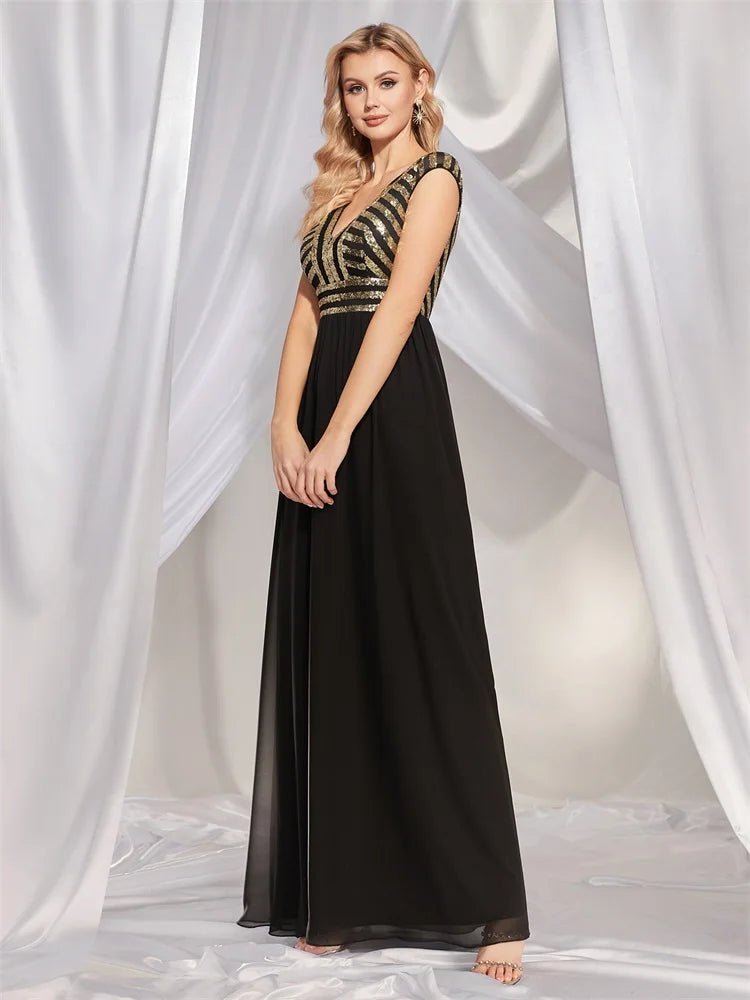 Elegant navy chiffon evening gown with sequins and cap sleeves.