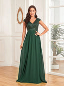 Elegant navy chiffon evening gown with sequin cap sleeves, size 8.