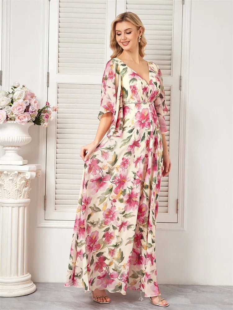 Floral chiffon maxi dress, short flared sleeves, vibrant colors, size M.