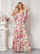 Floral chiffon maxi dress with short flared sleeves in vibrant colours.