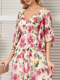 Floral chiffon maxi dress with short flared sleeves, multicolored design.