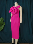 a mannequin wearing a pink dress with a flower on it