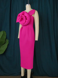 a mannequin wearing a pink dress with a flower on it