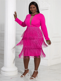 a woman in a pink dress posing for a picture