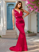 Red satin mermaid dress with lace-up back outdoors