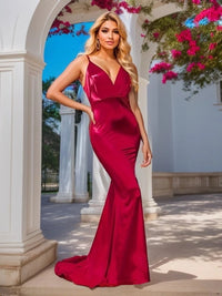 Red satin mermaid dress with V-neck under archway