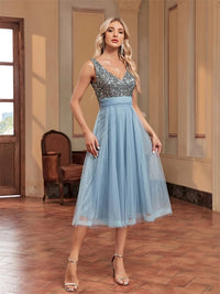 Light blue midi prom dress featuring rhinestone details, size M.