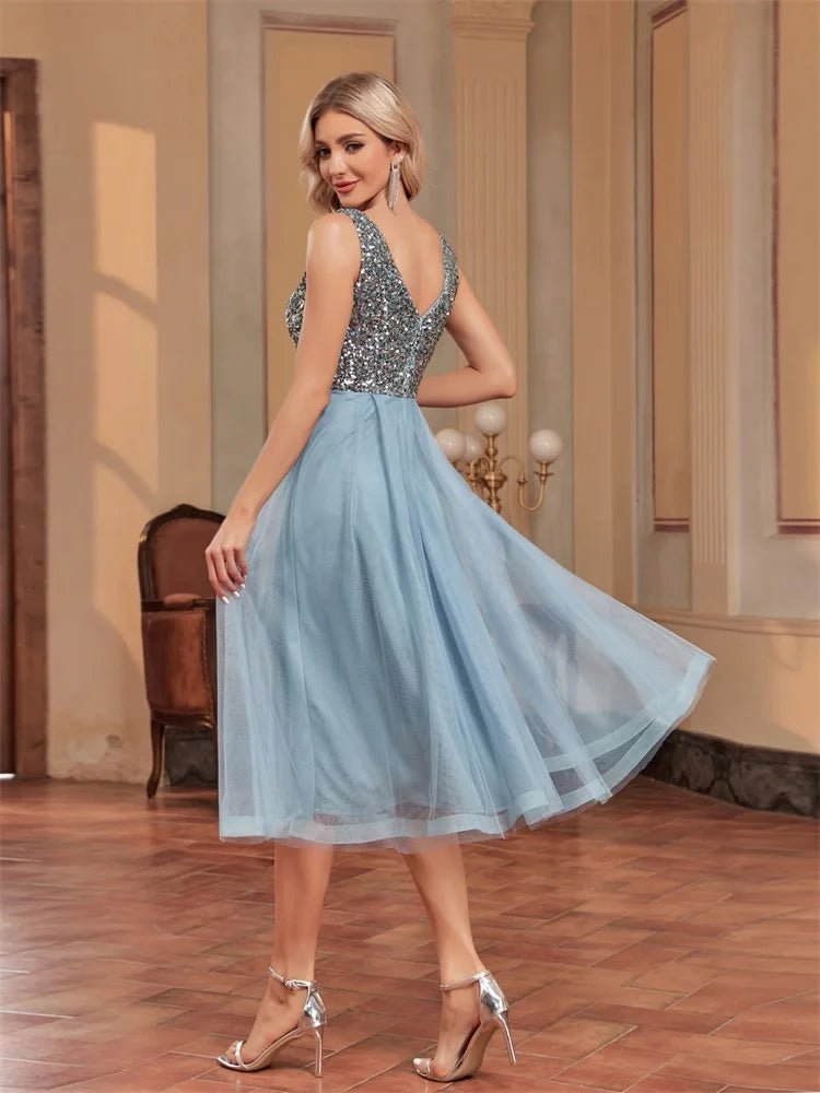 Alt text: "Light blue midi prom dress with rhinestone embellishments, size M."