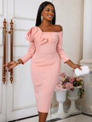 a woman in a pink dress posing for a picture