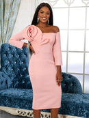 a woman in a pink dress posing for a picture