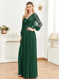 Elegant navy chiffon formal dress with long sleeves and high slit.