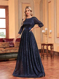 Navy blue formal evening dress with 3/4 sleeves and sequins embellishment.