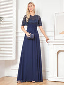 Navy short-sleeve embellished evening gown with a flowing silhouette.