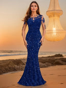 Royal blue sequin mermaid gown on beach at sunset