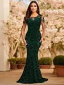 Emerald green sequin mermaid gown with illusion sleeves