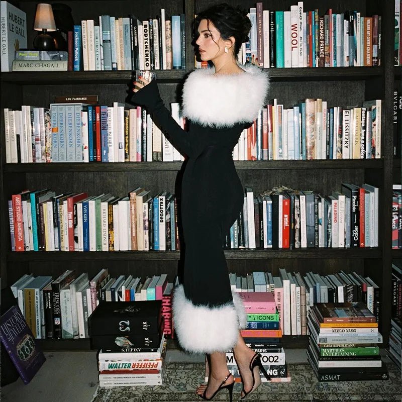 a woman standing in front of a book shelf