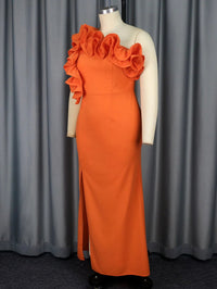 a mannequin wearing an orange dress with ruffles