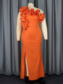 a mannequin wearing an orange dress with ruffles