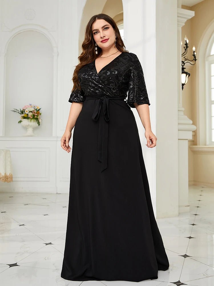 Plus-size black chiffon evening dress adorned with sequins, elegant fit.