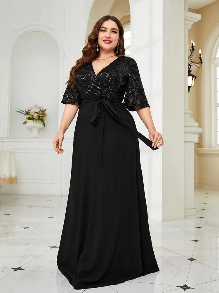 Plus-size black chiffon evening dress with sequin embellishments.