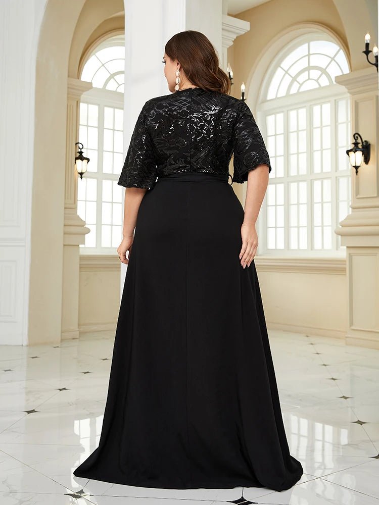 Elegant plus-size black chiffon evening dress with sequin details, size 16.