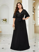 Plus-size black chiffon evening dress with sequin detail, size 16.