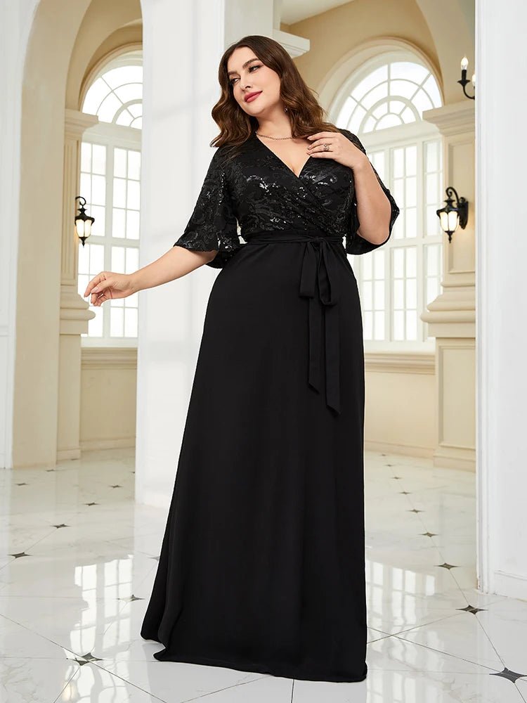 Plus size black chiffon evening dress with sequin details, elegant and flowy.