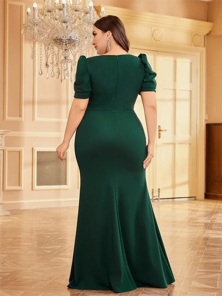 Plus-size green puffy short-sleeve maxi dress with floral appliqué.