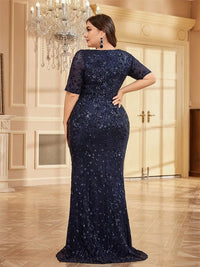 Plus-size sequin mermaid formal dress in navy, with elegant sleeves.