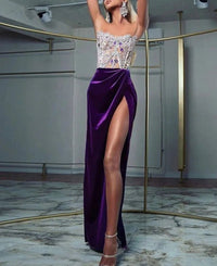 a woman in a purple dress with a high slit