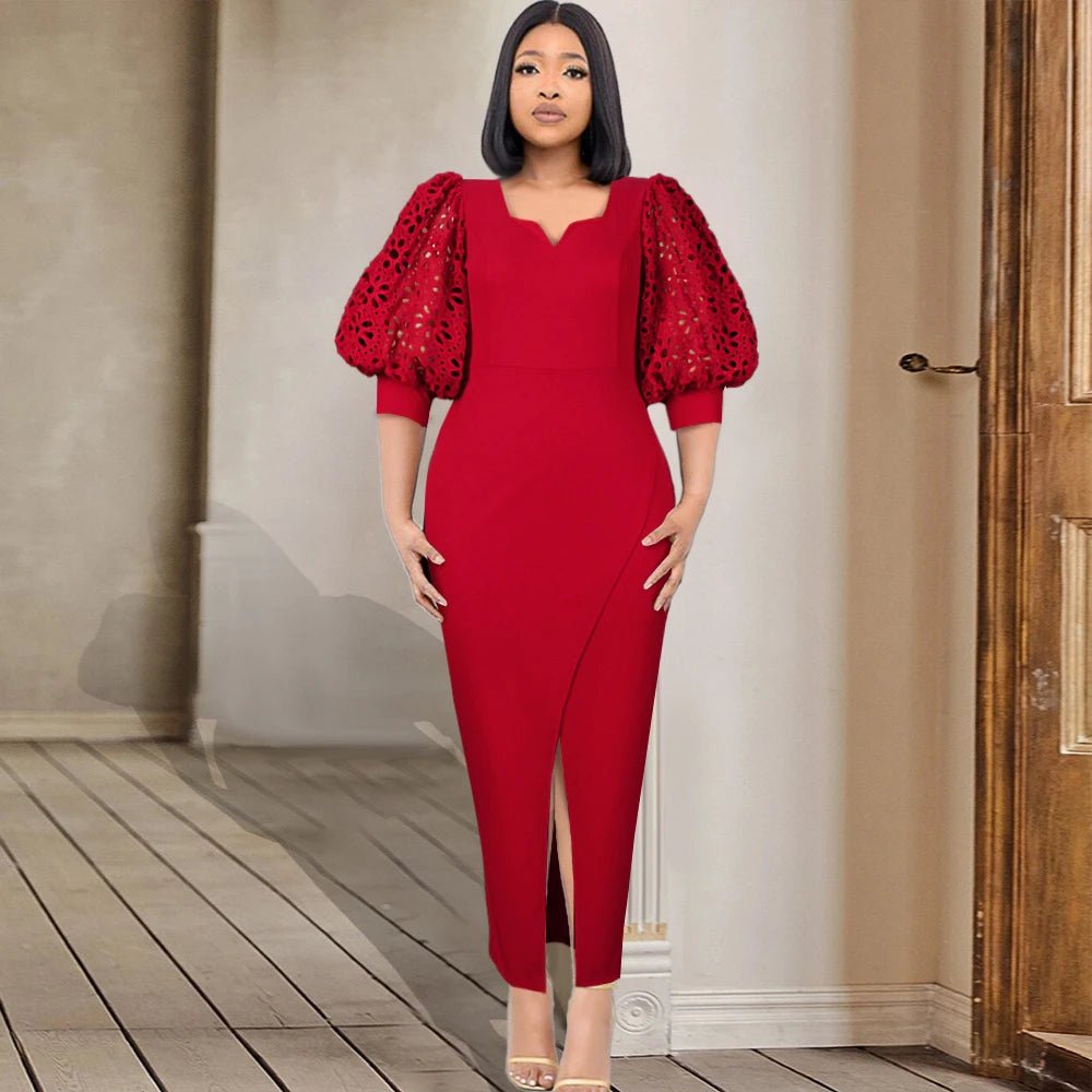 a woman in a red dress standing in a room