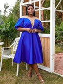 a woman in a blue dress posing for a picture