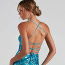 the back of a woman wearing a blue dress