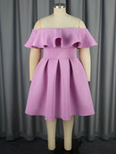 a mannequin wearing a pink dress with ruffles