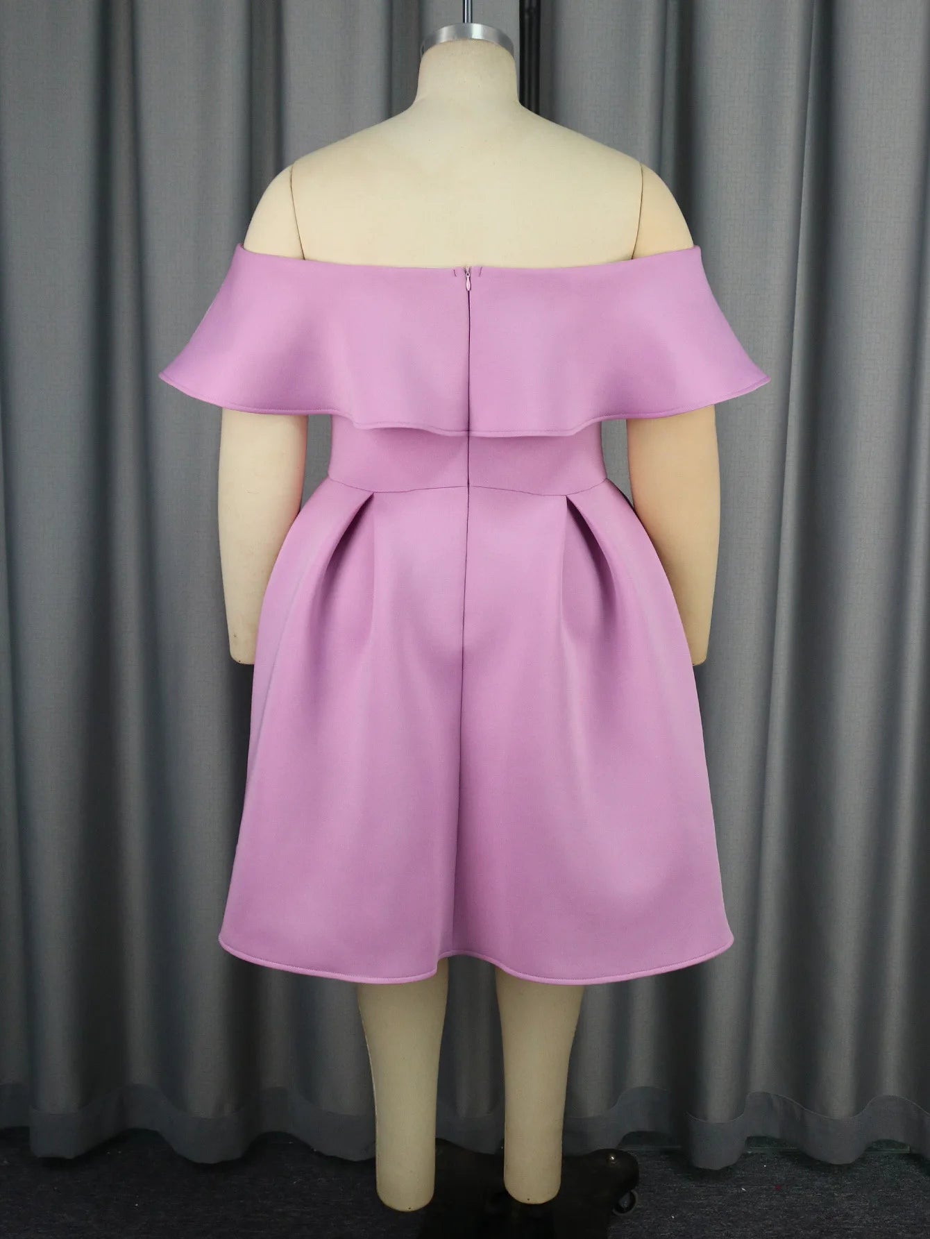 a mannequin with a purple dress on it